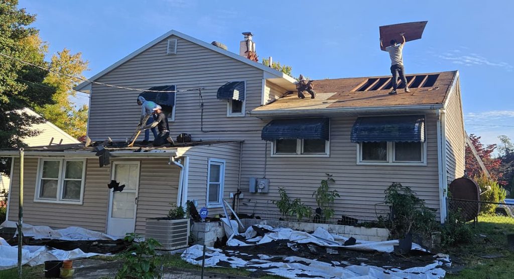 Tearing off old roof, before new roof in New Castle, DE