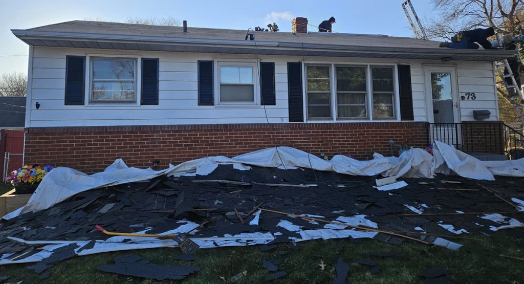 Tearing off the old roof in New Castle, DE