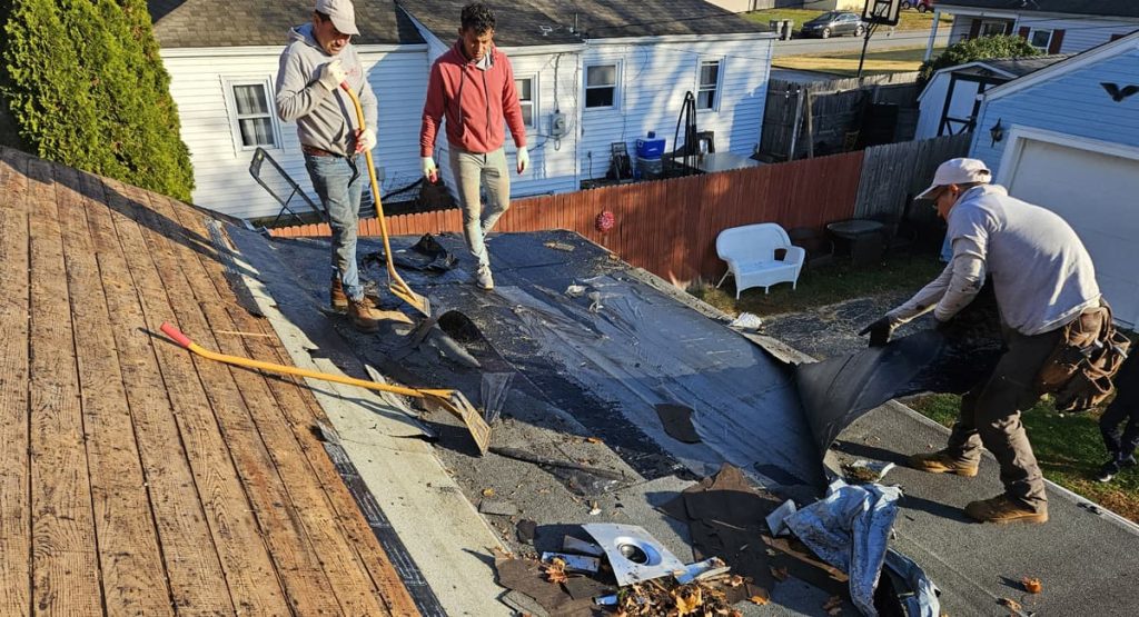 Tearing off old roof in Newport, DE