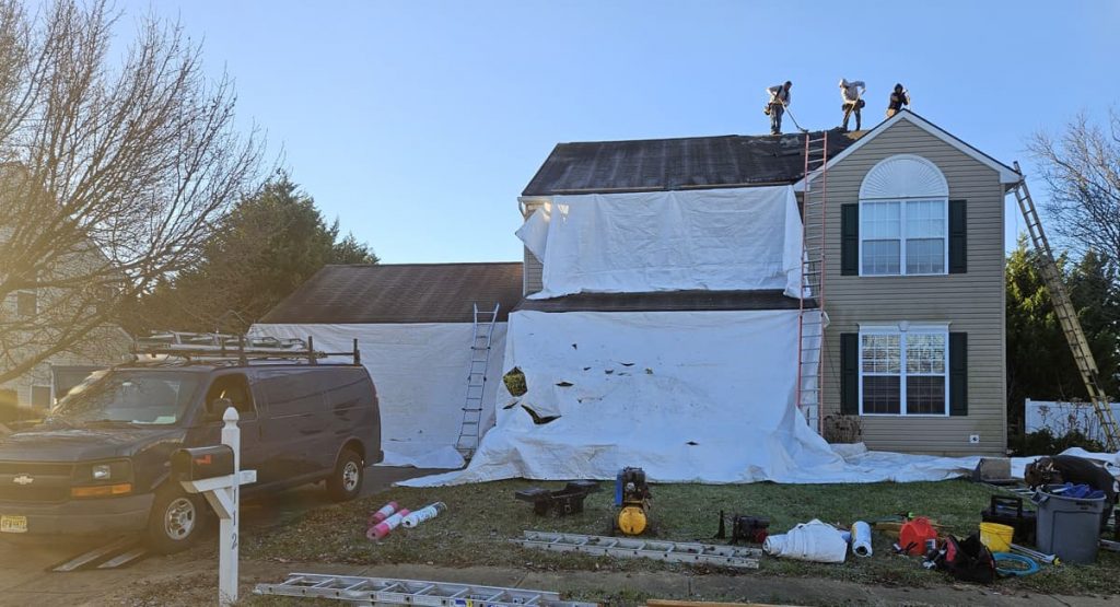 Tearing off old worn roof in Middletown, DE