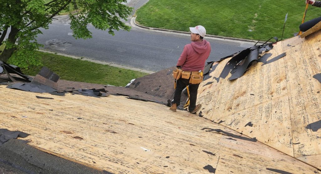 Tearing off old roof in Pennsville, NJ