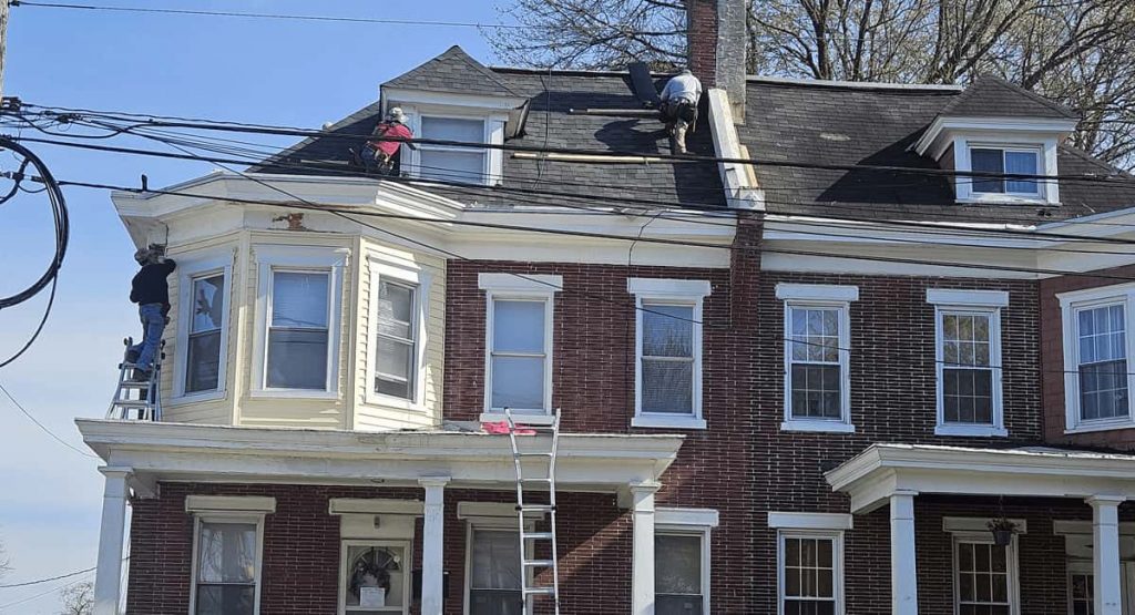 Tearing off old roof in Wilmington, DE