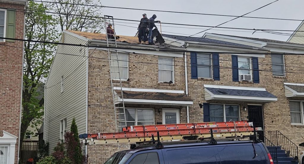 Tearing off old roof in Wilmington, DE