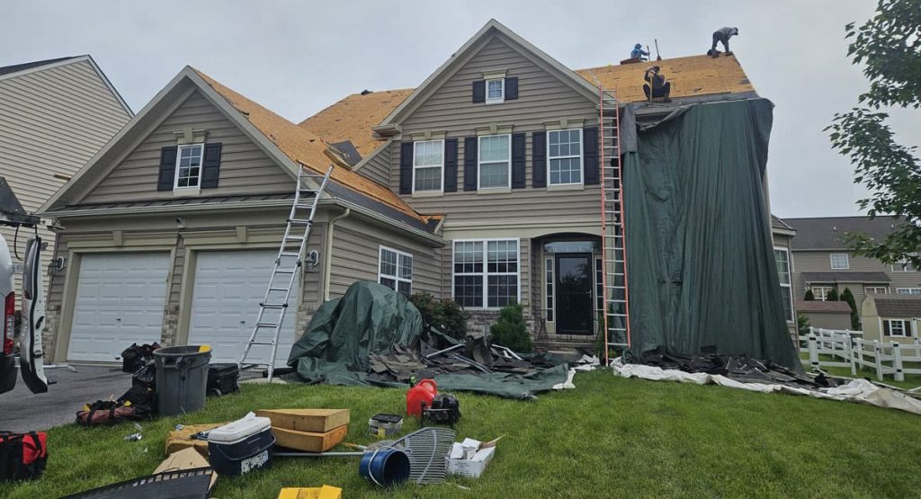 Tearing off old roof in Middletown, DE