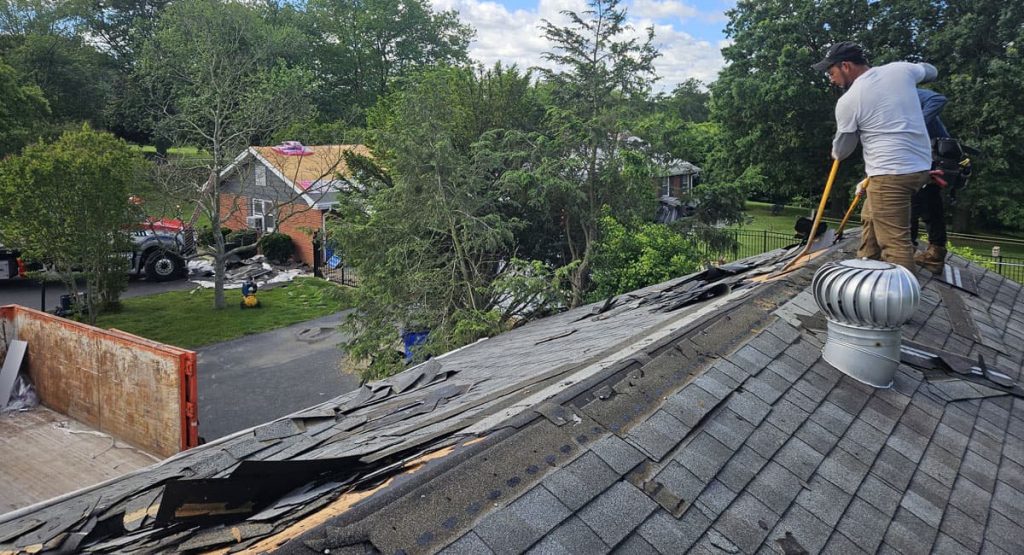 Tearing off old roof in Middletown, DE