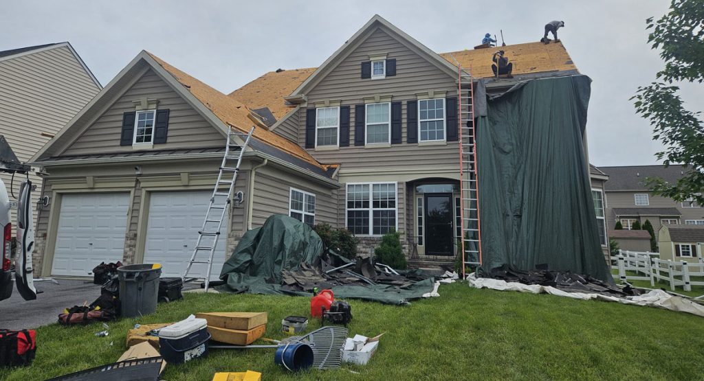 Tearing off old roof in Middletown, DE