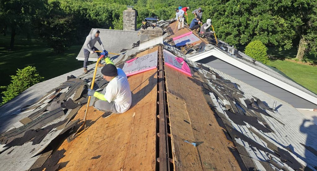 Tearing off old roof in Middletown, DE