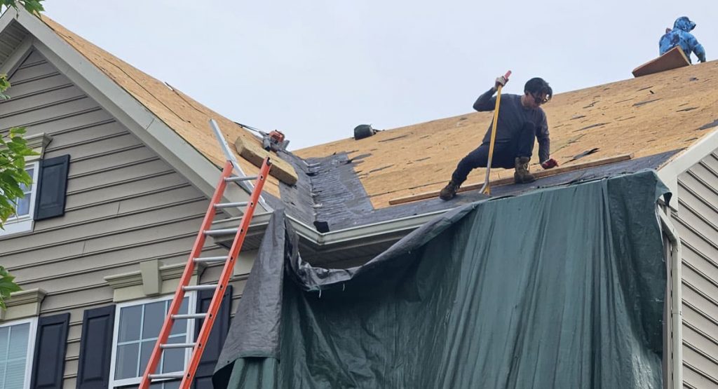 Tearing off old roof in Middletown, DE