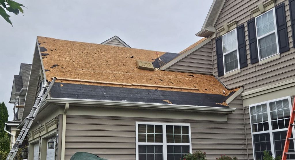Tearing off old roof in Middletown, DE