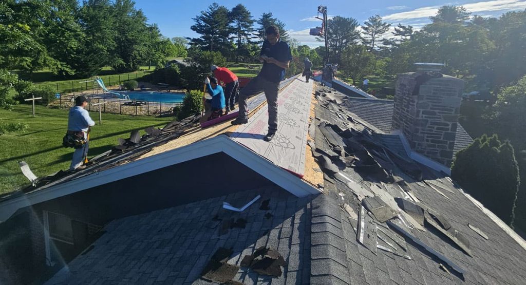 Tearing off old roof in Middletown, DE