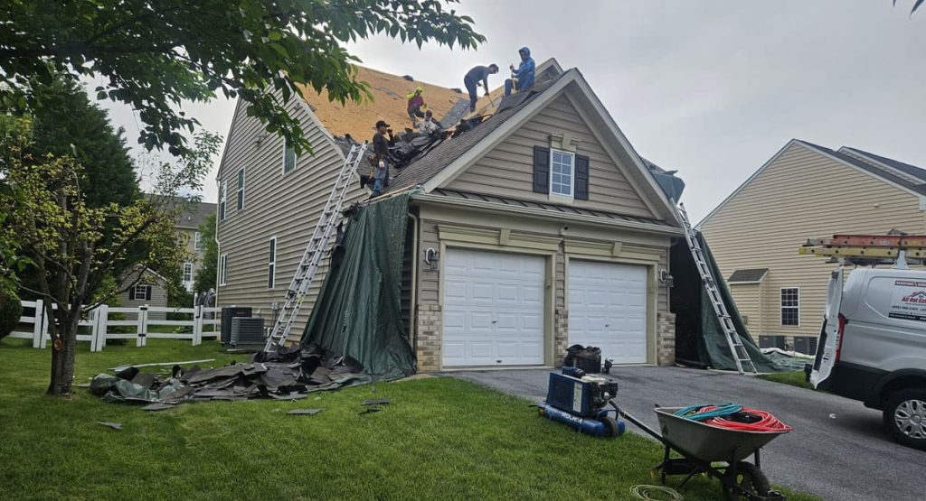 Tearing off old roof in Middletown, DE
