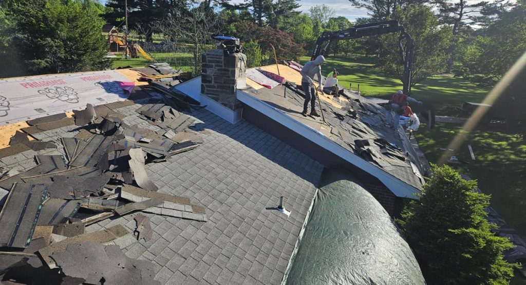 Tearing off old roof in Middletown, DE