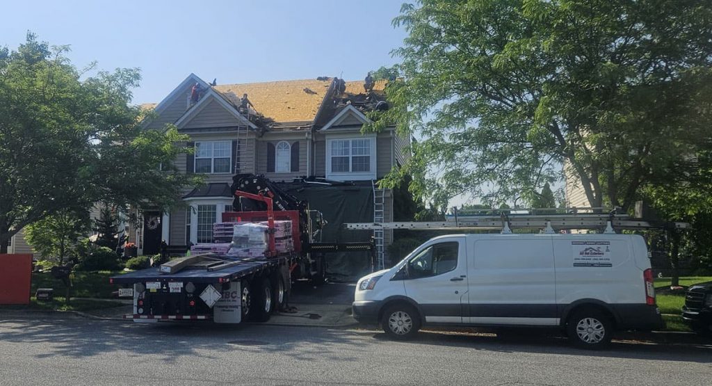 Tearing off old roof in Middletown, DE