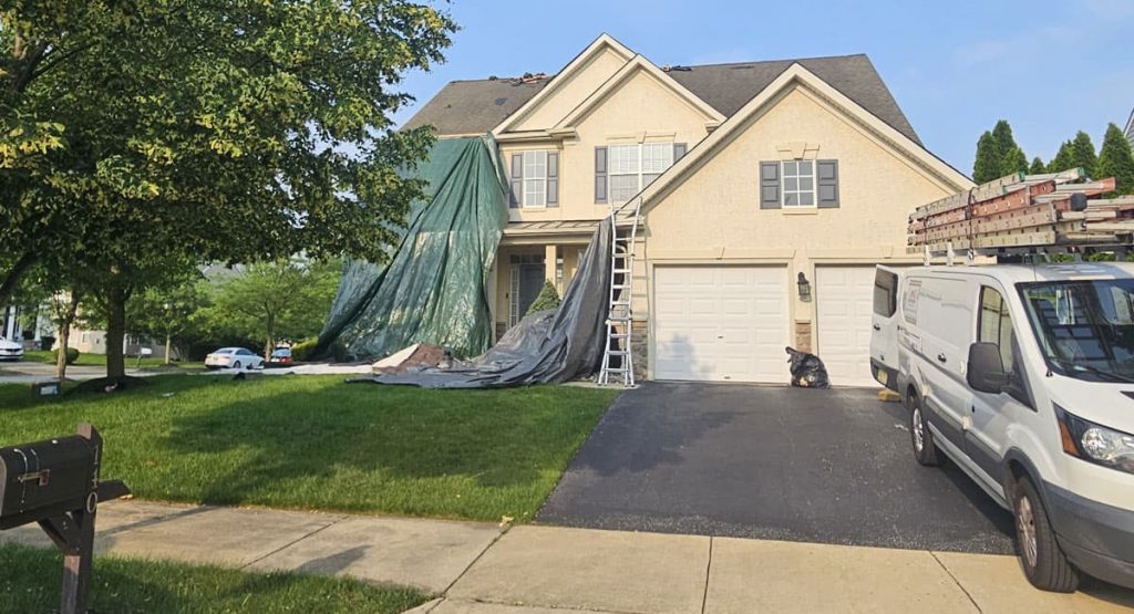 Tearing off old roof in Middletown, DE