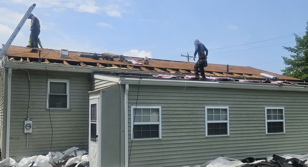 Tearing off old roof in Middletown, DE
