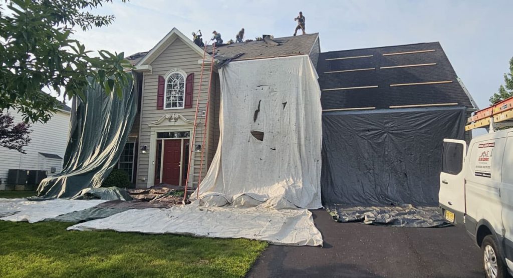 Tearing off old roof in Middletown, DE