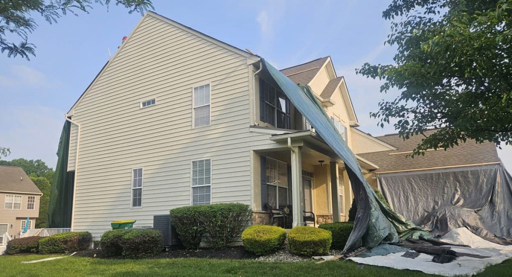 Tearing off old roof in Middletown, DE