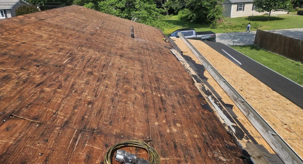 Tearing off old roof in Middletown, DE