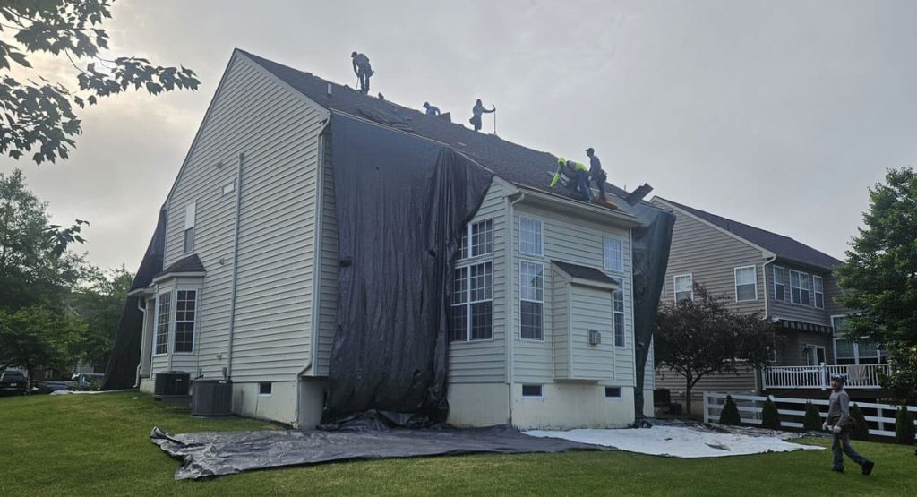 Tearing off old roof in Middletown, DE