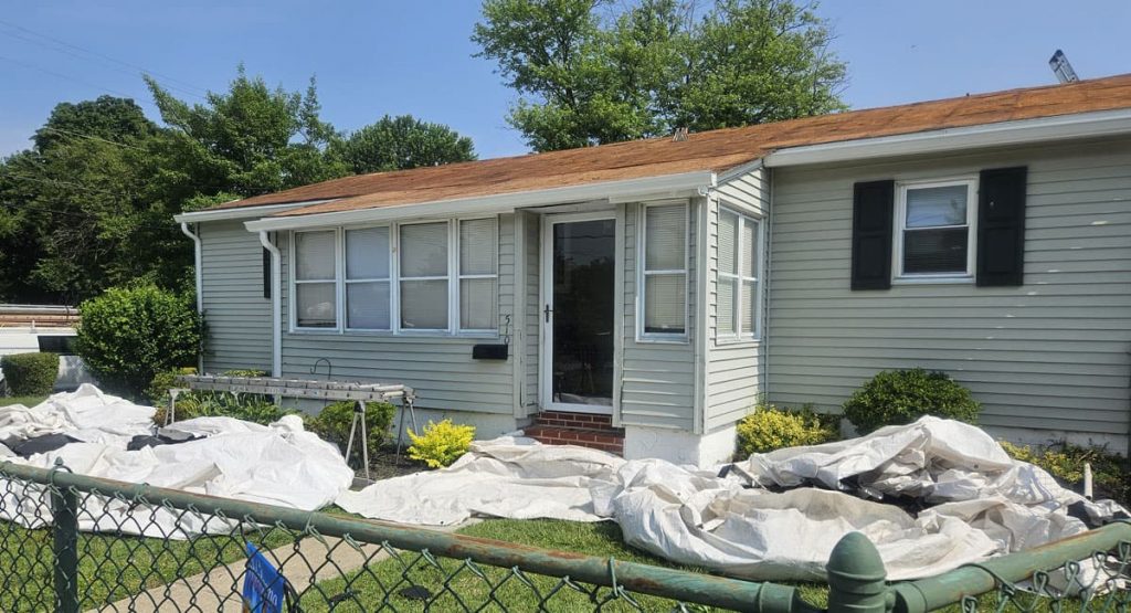 Tearing off old roof in Middletown, DE