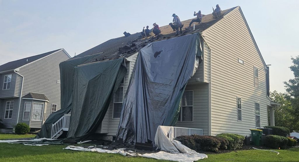 Tearing off old roof in Middletown, DE