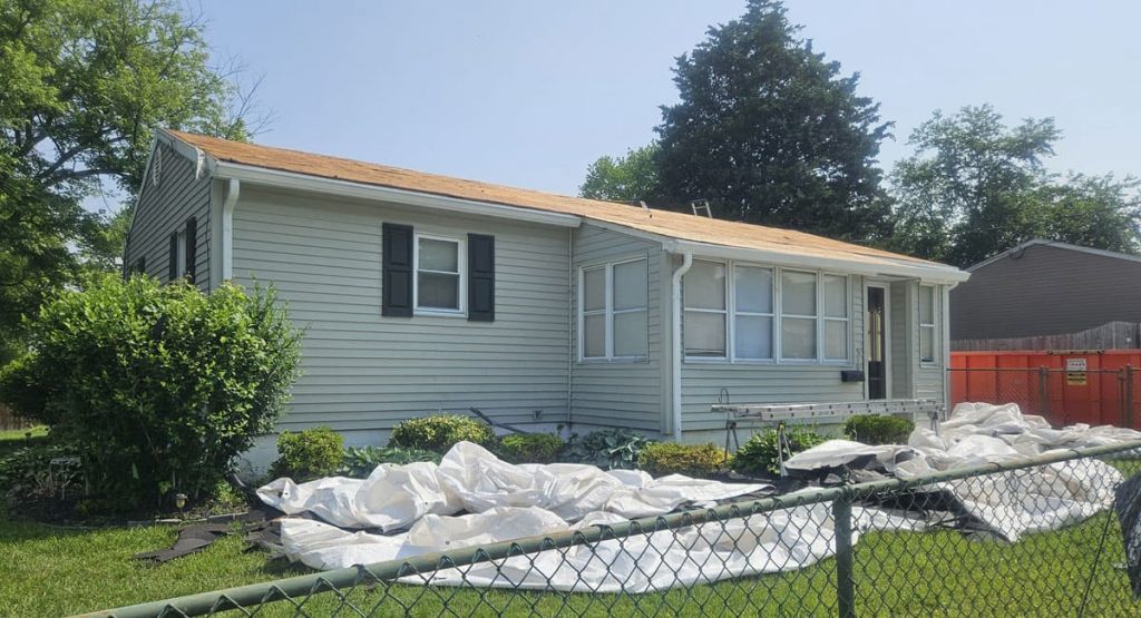 Tearing off old roof in Middletown, DE