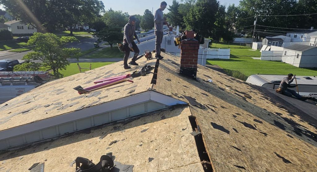Tearing off old roof in Newark, DE