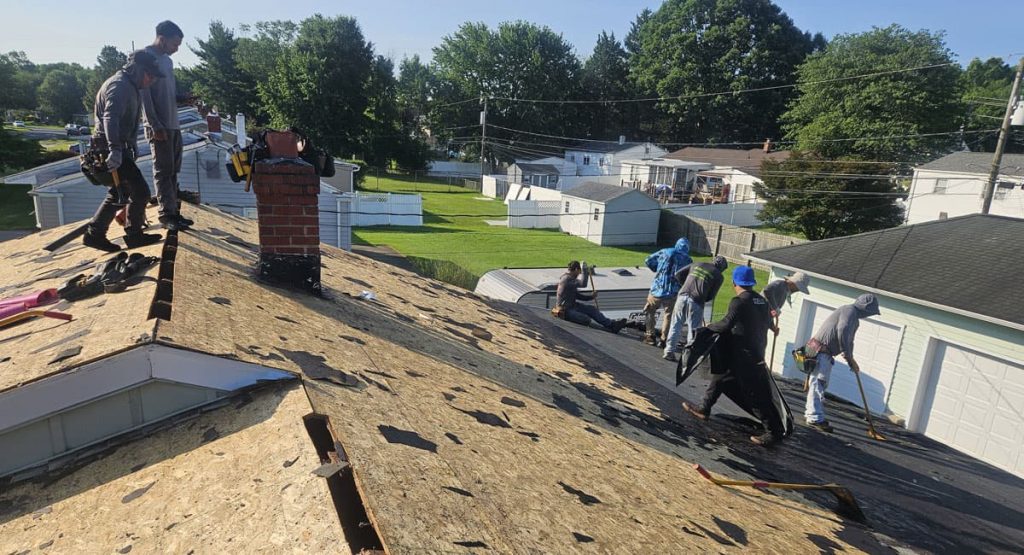 Tearing off old roof in Newark, DE