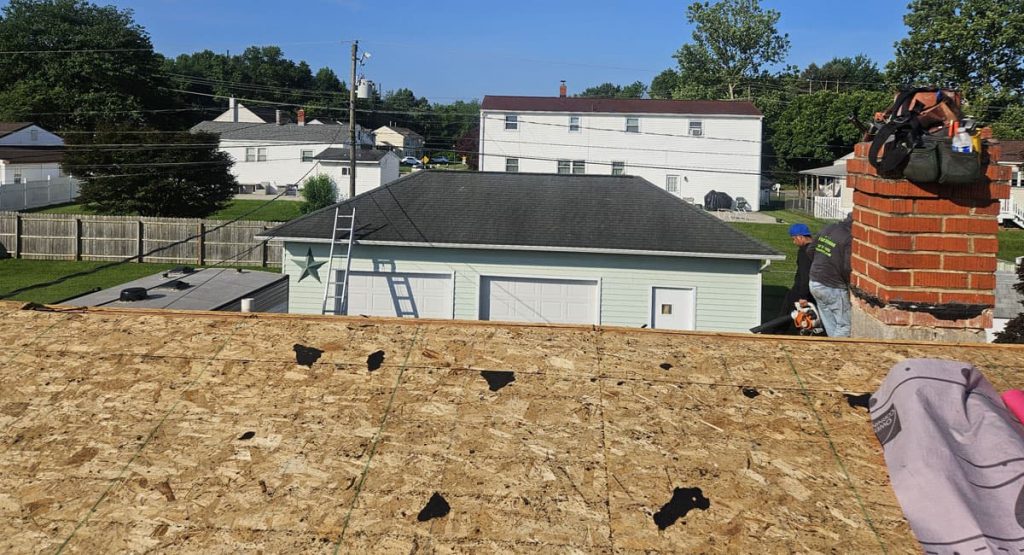 Tearing off old roof in Newark, DE