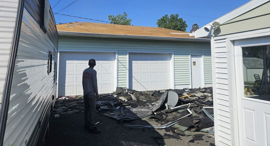 Tearing off old roof in Newark, DE