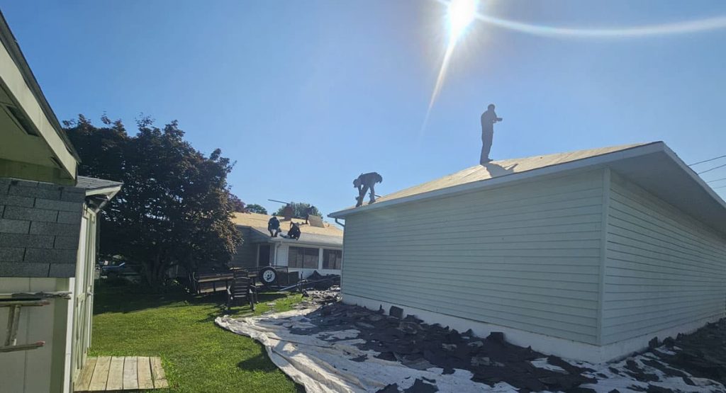 Tearing off old roof in Newark, DE