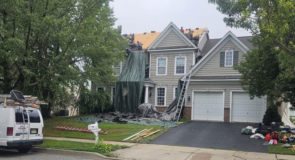 Tearing off old roof in Middletown, DE