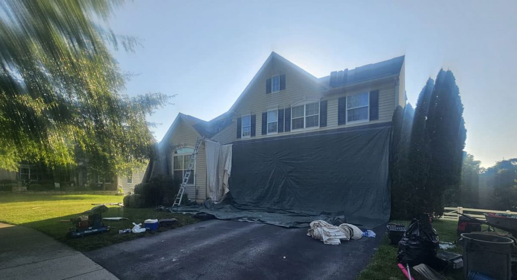 Tearing off old roof in Middletown, DE