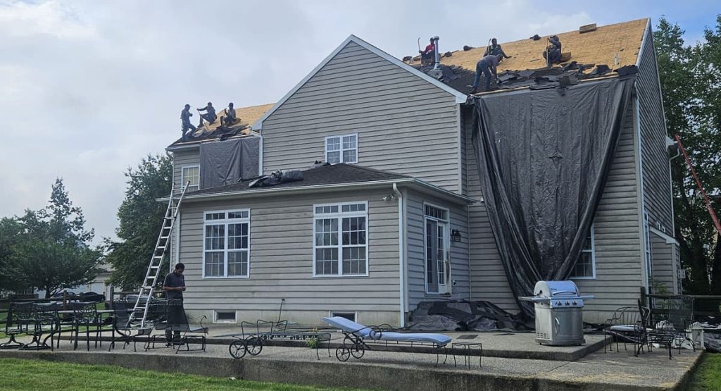 Tearing off old roof in Middletown, DE