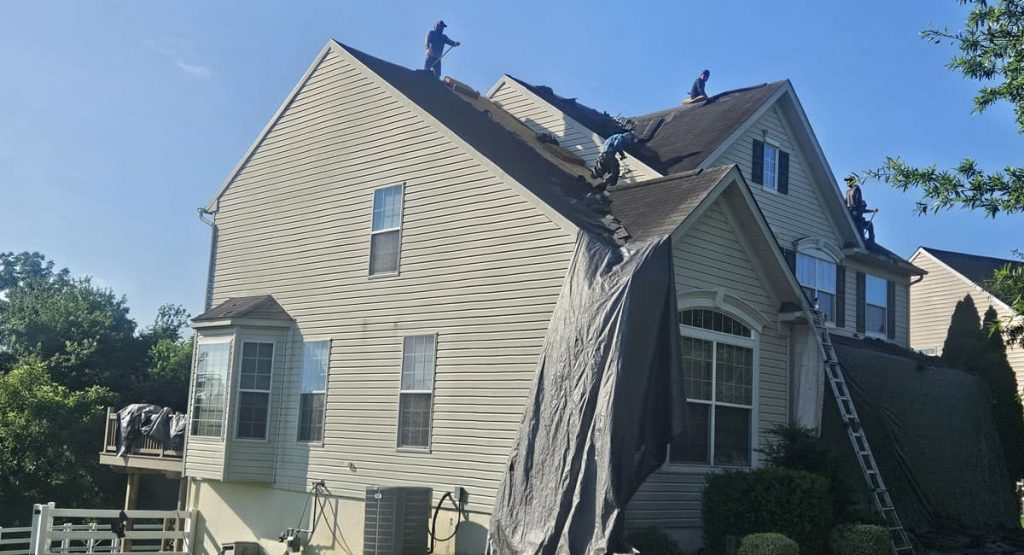Tearing off old roof in Middletown, DE