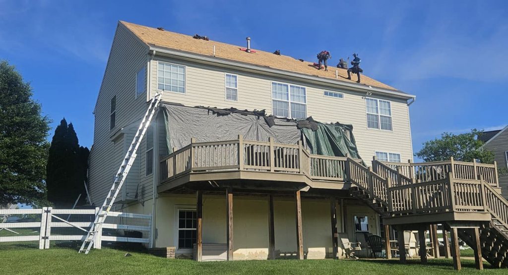 Tearing off old roof in Middletown, DE