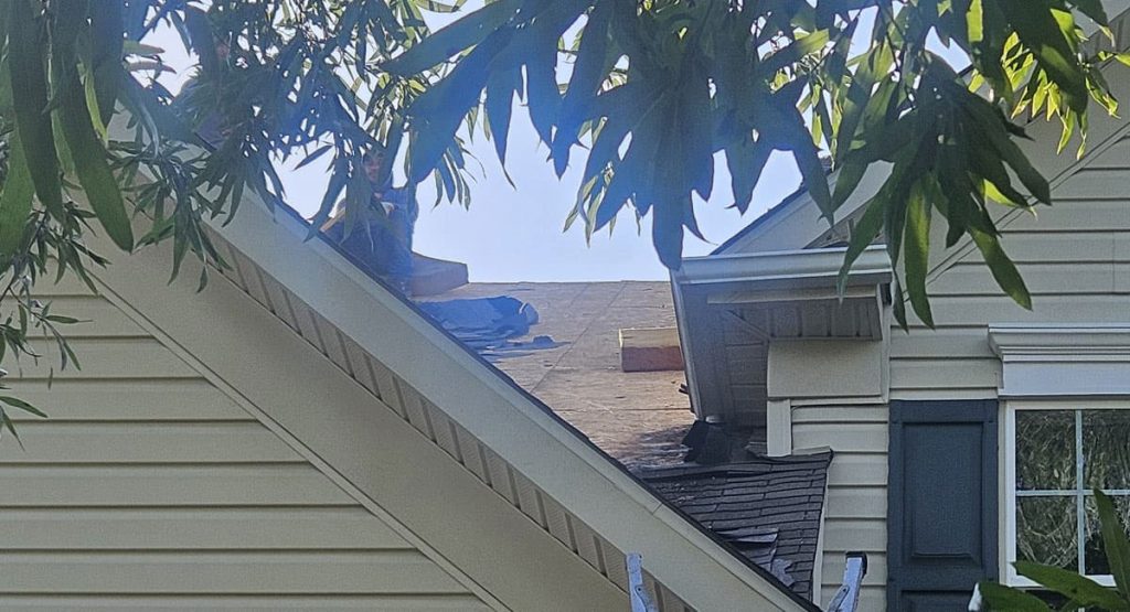 Tearing off old roof in Middletown, DE
