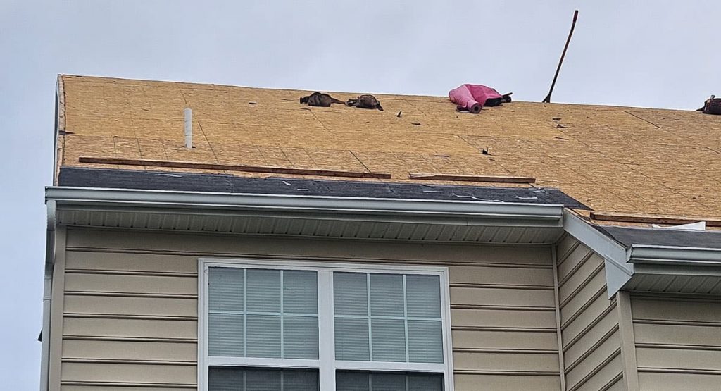 Tearing off old roof in Middletown, DE