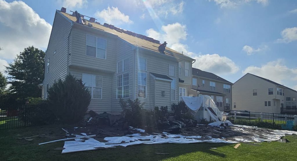 Tearing off old roof in Middletown, DE