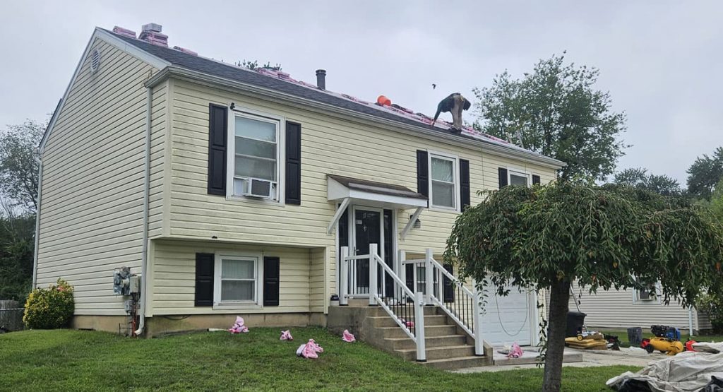 Tearing off old roof in Newark, DE