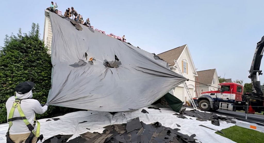 Tearing off old roof in Middletown, DE