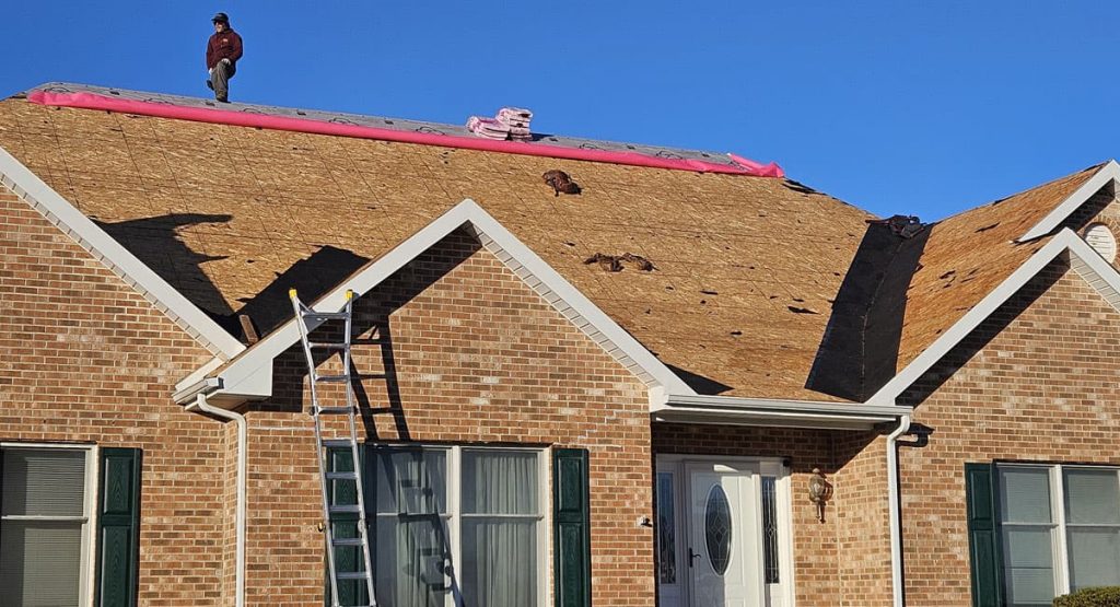 Tearing off the old roof in Bear, DE