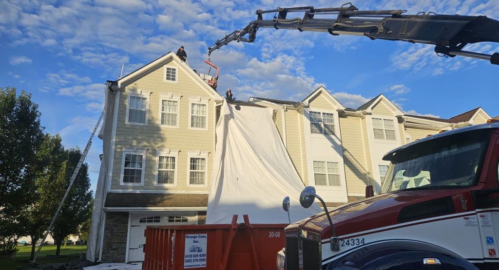 Tearing off the old roof in Dover, DE