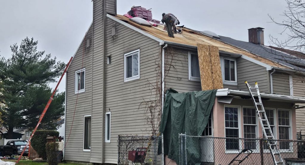 Tearing off the old roof in New Castle, DE