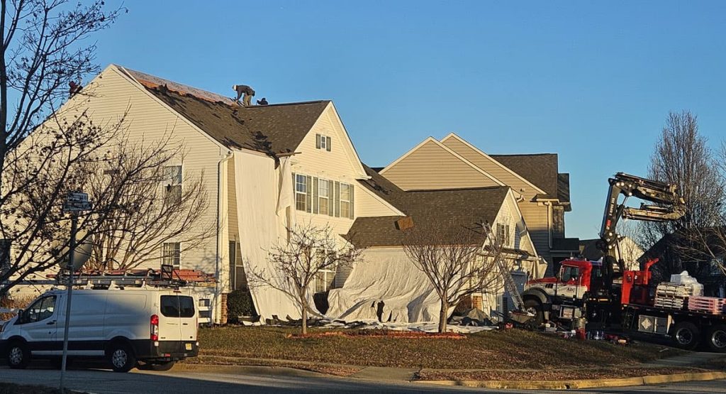 Tearing off old roof in Middletown, DE