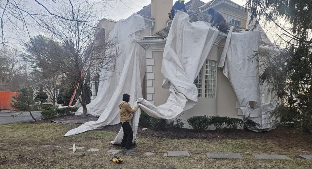 Tearing off old roof in Wilmington, DE