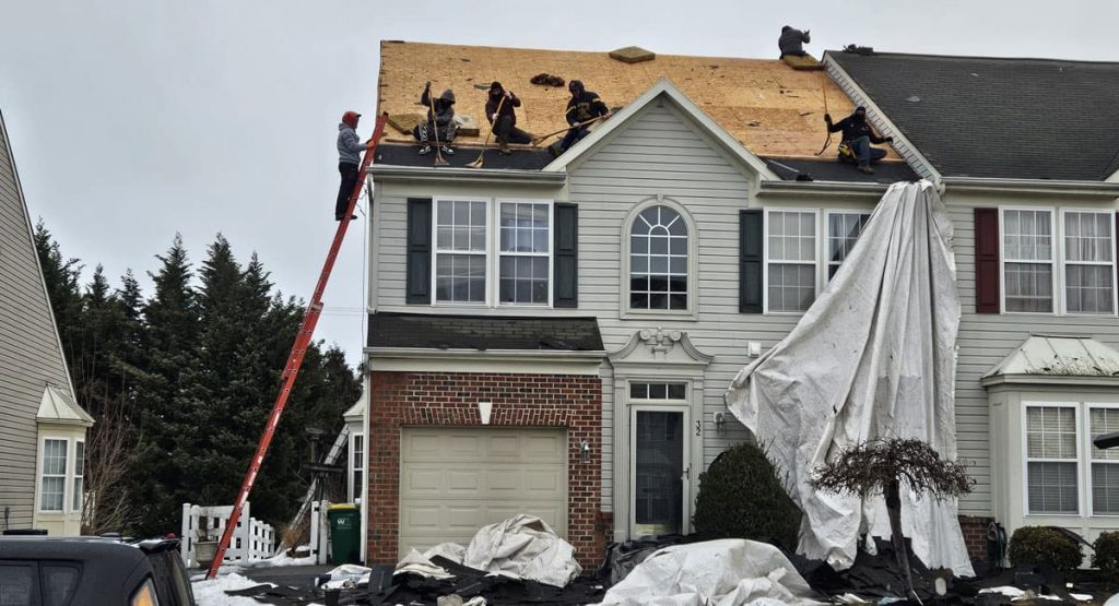 Tearing off old roof in Middletown, DE