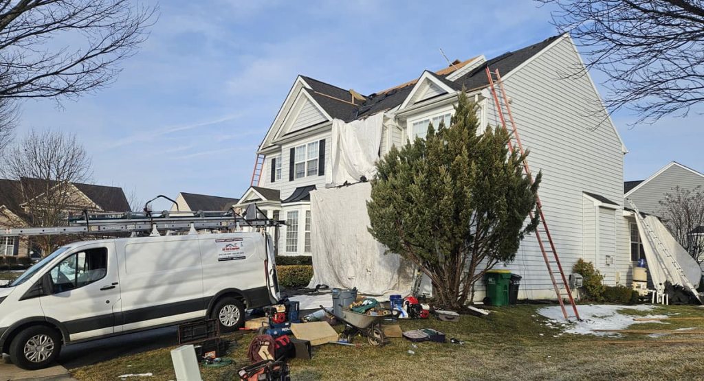Tearing off old roof in Middletown, DE