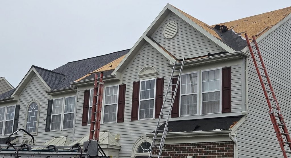 Tearing off old roof in Middletown, DE