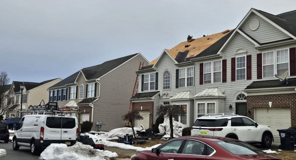 Tearing off old roof in Middletown, DE
